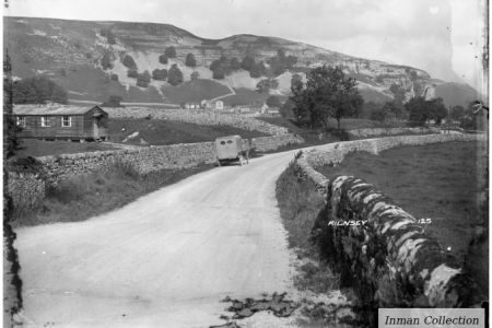 CK-12-125 Road into Kilnsey, with crag.jpg